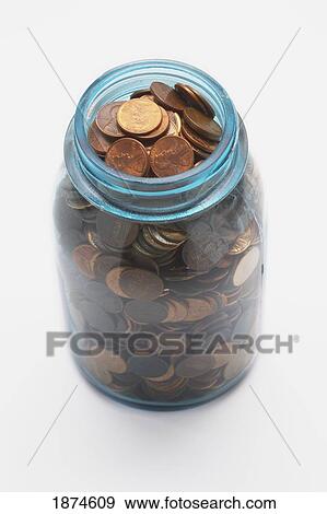 Stock Photo - knoxville, tennessee, united states of america; pennies in a glass jar. Fotosearch