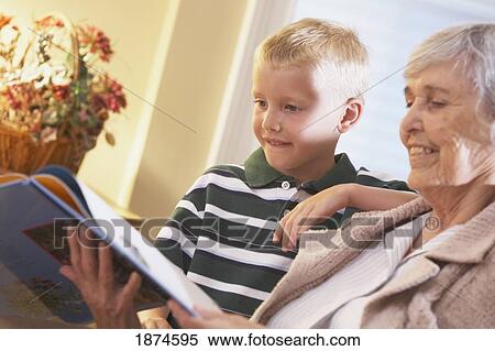 knoxville, tennessee, united states of america; a grandmother reads a book to her grandson View Large Photo Image Stock Photography - knoxville, tennessee, united states of america; a grandmother reads a book to her grandson. Fotosearch