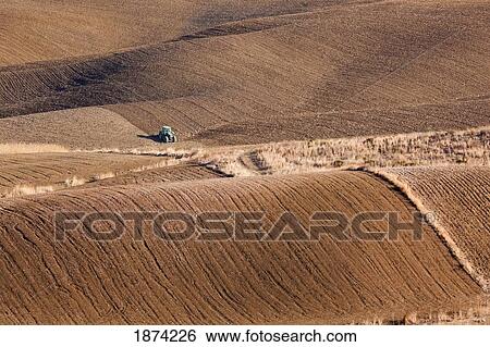 malaga, spain; green tractor ploughing fields near alhaurin el grande View Large Photo Image Stock Photograph - malaga, spain; green tractor ploughing fields near alhaurin el grande. Fotosearch