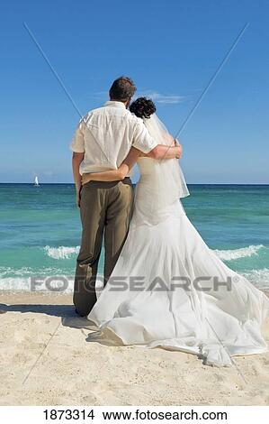 Picture - mayan riviera, akumal, mexico; bride and groom at the beach at gran bahia principe tulum all-inclusive resort. Fotosearch