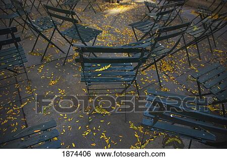Stock Photograph - new york, new york, united states of america; chairs on concrete in autumn. Fotosearch