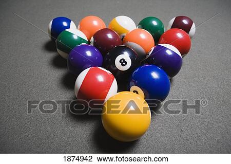 Stock Image - pool balls on a billiard table with the eight ball facing upwards. Fotosearch