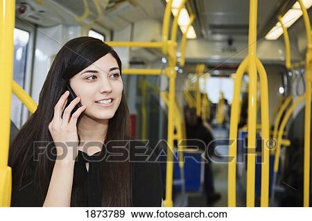 portland, oregon, united states of america; a teenage girl using her cell phone while riding public transportation View Large Photo Image Stock Photo - portland, oregon, united states of america; a teenage girl using her cell phone while riding public transportation. Fotosearch