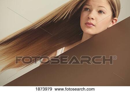 Stock Photo - portrait of a girl with long, straight hair. Fotosearch