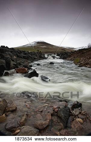 Picture - scottish borders, scotland; a river flowing over rocks. Fotosearch
