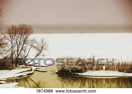 Stock Photo - st. catharines, ontario, canada; snow along the shore of lake ontario. Fotosearch