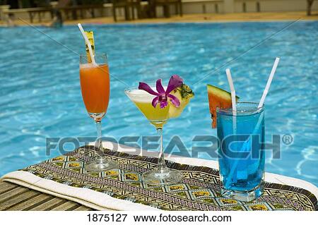 tropical drinks at the pool View Large Photo Image Stock Photo - tropical drinks at the pool. Fotosearch