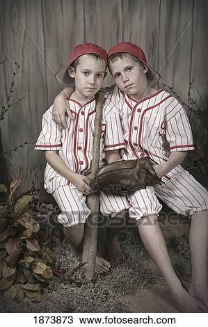 two boys wearing baseball uniforms View Large Photo Image Stock Image - two boys wearing baseball uniforms. Fotosearch