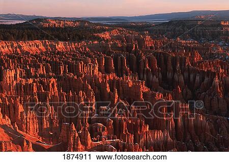 utah, united states of america; sandstone hoodoos of bryce amphitheater viewed from inspiration point at sunrise in winter in bryce canyon national park View Large Photo Image Stock Image - utah, united states of america; sandstone hoodoos of bryce amphitheater viewed from inspiration point at sunrise in winter in bryce canyon national park. Fotosearch