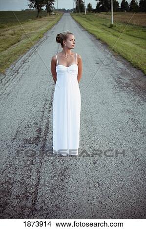 vineland, ontario, canada; a bride standing in the middle of the road View Large Photo Image Picture - vineland, ontario, canada; a bride standing in the middle of the road. Fotosearch
