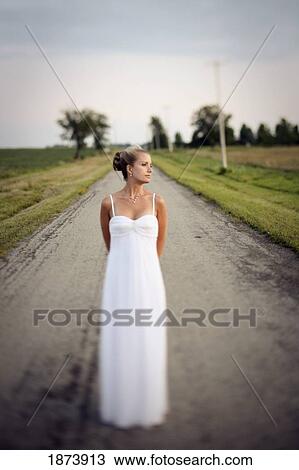vineland, ontario, canada; a bride standing in the middle of the road View Large Photo Image Stock Image - vineland, ontario, canada; a bride standing in the middle of the road. Fotosearch