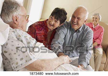 visiting an elderly man in bed View Large Photo Image Stock Image - visiting an elderly man in bed. Fotosearch
