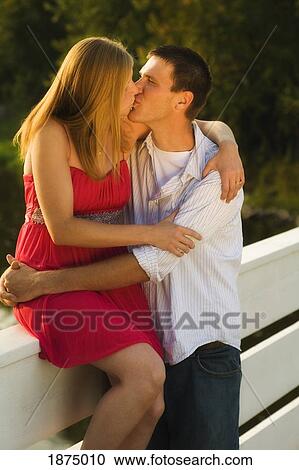 Stock Image - willmar, minnesota, united states of america; a couple kissing. Fotosearch
