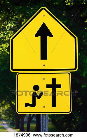 willmar, minnesota, united states of america; a sign with an arrow and a person kneeling at a cross View Large Photo Image Stock Photograph - willmar, minnesota, united states of america; a sign with an arrow and a person kneeling at a cross. Fotosearch