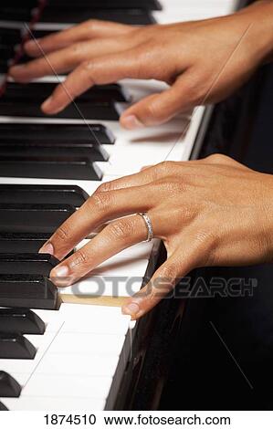 Woman playing piano View Large Photo Image Stock Image - Woman playing piano. Fotosearch