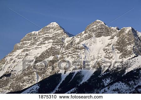alberta, canada; snow covered mountain peaks in kananaskis country View Large Photo Image Stock Image - alberta, canada; snow covered mountain peaks in kananaskis country. Fotosearch