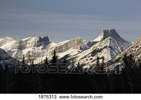 alberta, canada; snow covered mountain range in the morning in kananaskis country View Large Photo Image Stock Image - alberta, canada; snow covered mountain range in the morning in kananaskis country. Fotosearch