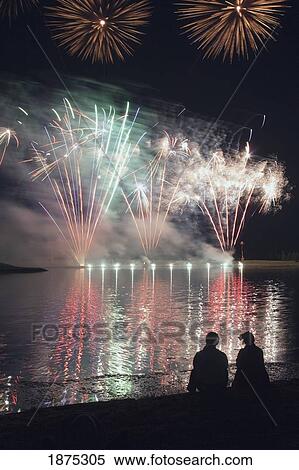 calgary, alberta, canada; a couple viewing fireworks with the reflection in the lake View Large Photo Image Stock Photography - calgary, alberta, canada; a couple viewing fireworks with the reflection in the lake. Fotosearch