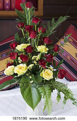 Stock Image - Chiang mai, thailand; a flower arrangement sitting on a table at the horizon resort. Fotosearch
