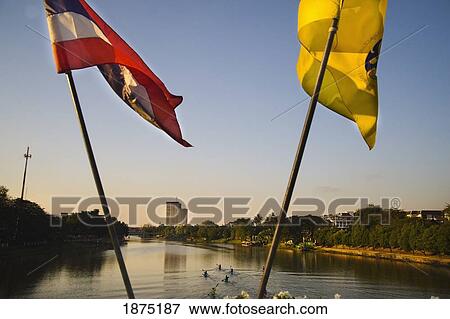 Chiang mai, thailand; flags on the front of a boat in a river View Large Photo Image Stock Photo - Chiang mai, thailand; flags on the front of a boat in a river. Fotosearch