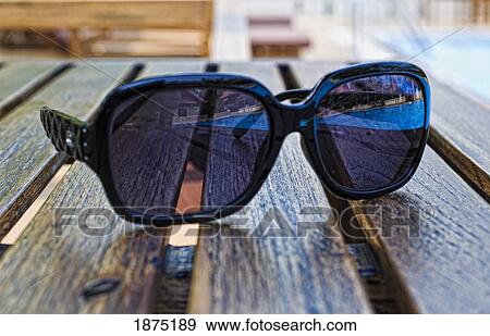 chiang mai, thailand; sunglasses sitting on a table at horizon resort View Large Photo Image Stock Photo - chiang mai, thailand; sunglasses sitting on a table at horizon resort. Fotosearch