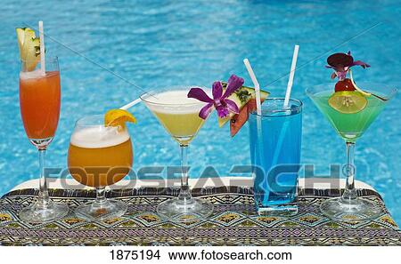 chiang mai, thailand; tropical drinks by the pool at horizon resort View Large Photo Image Picture - chiang mai, thailand; tropical drinks by the pool at horizon resort. Fotosearch