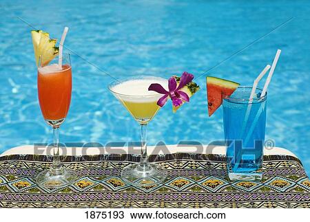 Stock Image - chiang mai, thailand; tropical drinks by the pool at horizon resort. Fotosearch