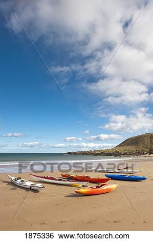coldingham, scottish borders, scotland; kayaks sitting on the sand at the shore View Large Photo Image Stock Photograph - coldingham, scottish borders, scotland; kayaks sitting on the sand at the shore. Fotosearch