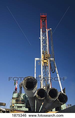 edson, alberta, canada; drilling rig with pipes in the foreground View Large Photo Image Stock Photograph - edson, alberta, canada; drilling rig with pipes in the foreground. Fotosearch