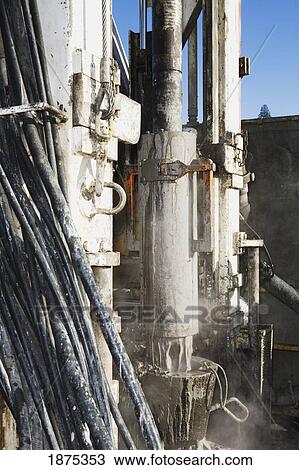 Stock Image - edson, alberta, canada; view of rig floor, drill pipe connection and drilling mud for oil and gas drilling. Fotosearch