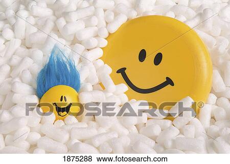 Stock Photo - happy faces in styrofoam packing peanuts. Fotosearch