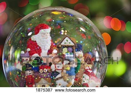 Stock Photo - oregon, united states of america; a christmas snow globe with santa claus in it. Fotosearch