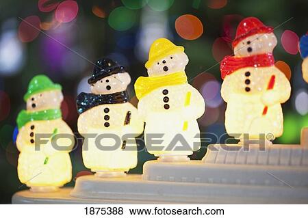 Stock Photo - oregon, united states of america; illuminated snowmen as christmas decorations. Fotosearch
