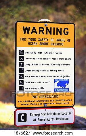 Stock Photo - oregon, united states of america; warning sign at shore acres state park along the coast of the pacific ocean. Fotosearch