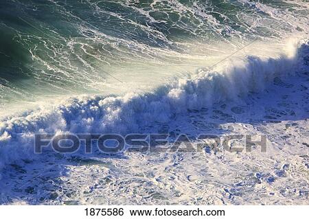 Stock Photograph - oregon, united states of america; incoming waves along the coast of the pacific ocean. Fotosearch