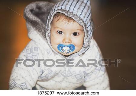 portland, oregon, united states of america; a baby boy with a blue soother in his mouth View Large Photo Image Stock Photo - portland, oregon, united states of america; a baby boy with a blue soother in his mouth. Fotosearch