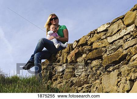 tarifa, costa de la luz, cadiz, andalucia, spain; a woman holding her baby at bunker beach View Large Photo Image Stock Photography - tarifa, costa de la luz, cadiz, andalucia, spain; a woman holding her baby at bunker beach. Fotosearch