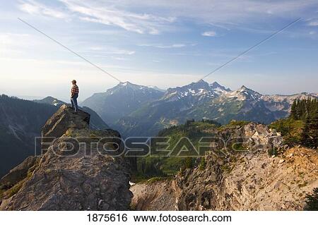 washington, united states of america; a man standing on a rock overlooking the tatoosh mountains in paradise park in mt. rainier national park View Large Photo Image Stock Photograph - washington, united states of america; a man standing on a rock overlooking the tatoosh mountains in paradise park in mt. rainier national park. Fotosearch