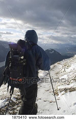 Stock Image - washington, united states of america; hiker on dog mountain in winter. Fotosearch