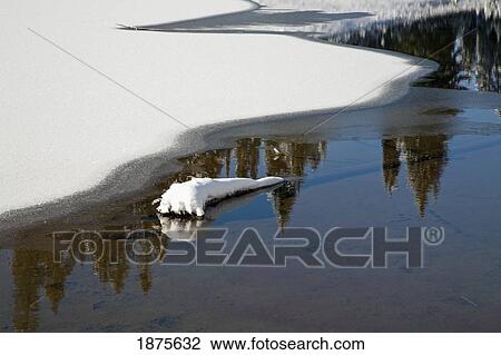 Stock Image - Washington, united states of america; snow around tipsoo lake in mt. rainier national park. Fotosearch