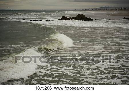 waves crashing as they hit the shore View Large Photo Image Stock Photograph - waves crashing as they hit the shore. Fotosearch