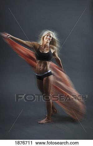 A Woman Exercising With A Large Cloth View Large Photo Image Stock Image - A Woman Exercising With A Large Cloth. Fotosearch