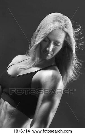 Picture - A Woman's Muscular Body. Fotosearch