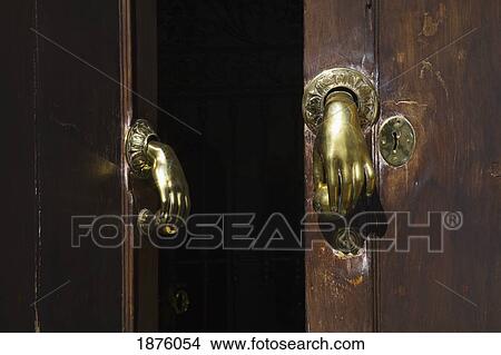 Arcos De La Frontera, Andalusia, Spain; Brass Door Knobs In The Shape Of A Hand View Large Photo Image Picture - Arcos De La Frontera, Andalusia, Spain; Brass Door Knobs In The Shape Of A Hand. Fotosearch