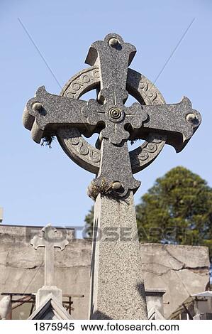 Stock Photography - Buenos Aires, Argentina; A Stone Cross On A Tomb In Recoleta Cemetery. Fotosearch