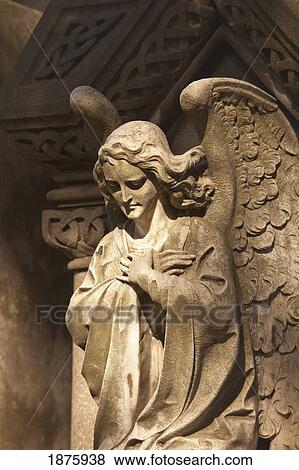 Stock Photo - Buenos Aires, Argentina; A Stone Statue Of An Angel In Recoleta Cemetery. Fotosearch