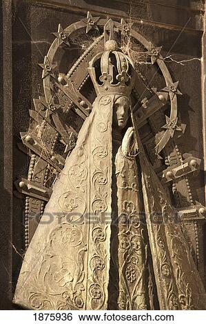 Stock Photograph - Buenos Aires, Argentina; A Stone Statue Of A Queen On A Mausoleum In Recoleta Cemetery. Fotosearch