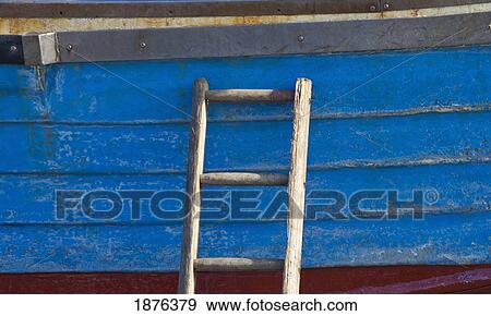 Stock Photo - Craster, Northumberland, England; A Wooden Ladder Propped Against The Side Of A Boat. Fotosearch
