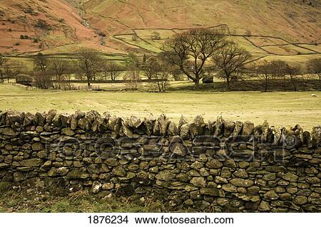 Cumbria, England; A Stone Wall In A Valley In Kirkstone Pass View Large Photo Image Picture - Cumbria, England; A Stone Wall In A Valley In Kirkstone Pass. Fotosearch