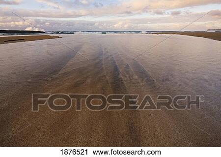 Kauai, Hawaii, United States Of America; Wave Wash Leading To A Breaking Wave On A Sandy Beach View Large Photo Image Stock Image - Kauai, Hawaii, United States Of America; Wave Wash Leading To A Breaking Wave On A Sandy Beach. Fotosearch